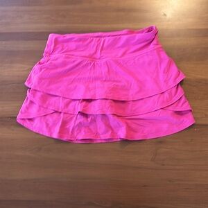 Bright pink Athleta Girl skort. Three pockets, perfect condition. Girls size XL.